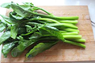 Blanched Chinese Broccoli with Oyster Sauce step 2: Use a vegetable peeler to remove the tough outer skin from the lower stems for a