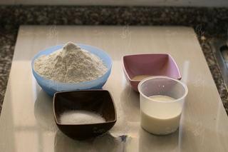 Steamed Milk Bread Rolls step 1: Prepare the flour, sugar, yeast, heavy cream, and water.