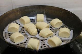 Steamed Milk Bread Rolls step 10: Place the rolls on parchment-lined steamer trays and proof for about 20 minutes 