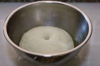 Steamed Milk Bread Rolls step 5: Cover and let the dough rise in a warm place until doubled in size. The dough is
