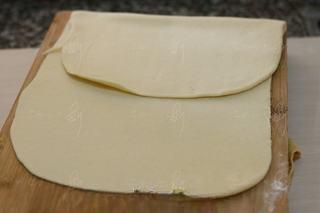 Steamed Milk Bread Rolls step 7: Roll the dough into a rectangle and lightly brush the surface with water.