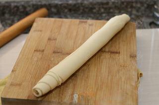 Steamed Milk Bread Rolls step 8: Roll the dough tightly into a log with an even thickness.
