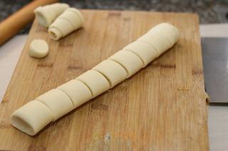 Steamed Milk Bread Rolls step 9: Gently flatten the log and cut it into evenly sized rolls.