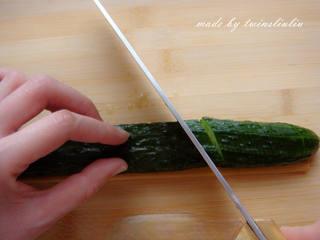Sichuan Peppercorn Cucumber Salad step 12: Make thin diagonal cuts at a 45-degree angle, again stopping at the chopstick.