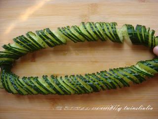 Sichuan Peppercorn Cucumber Salad step 14: Gently stretch the cucumber to reveal its decorative spiral pattern.
