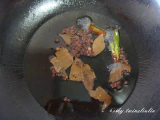 Sichuan Peppercorn Cucumber Salad step 4: Cook gently until the aromatics become dark brown and fragrant.