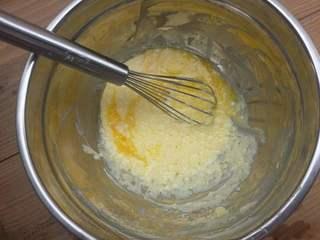 Cream Cheese Cake Recipe step 4: Add the egg yolks to the cream cheese mixture and mix until smooth.