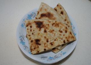Stir-Fried Pancake Strips with Napa Cabbage step 1: Prepare leftover pancakes or flatbreads.
