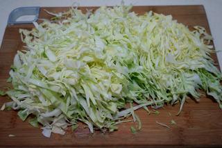 Stir-Fried Pancake Strips with Napa Cabbage step 6: Slice the napa cabbage into thin shreds.