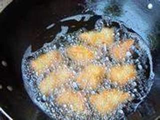 Chicken Breast Croquettes step 9: Heat oil over medium-low heat and fry the coated croquettes until golden brown a