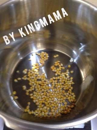 Creamy Caramel Popcorn step 3: Heat a frying pan over low heat. Add a small amount of vegetable oil and the pop