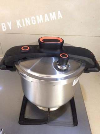 Creamy Caramel Popcorn step 4: Immediately cover the pan. Continue cooking until the popping slows to several s