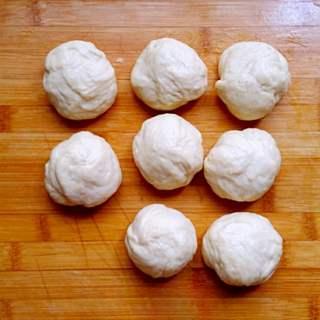 Sweet Red Bean Milk Bread Rolls Recipe step 4: Punch down the dough and divide it into 8 equal portions.