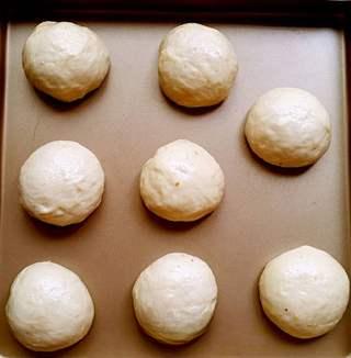 Sweet Red Bean Milk Bread Rolls Recipe step 6: Place the filled dough balls seam-side down on a baking tray.