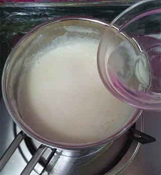 Savory Tofu Pudding step 10: Slowly pour in the dissolved coagulant while gently stirring to distribute it ev