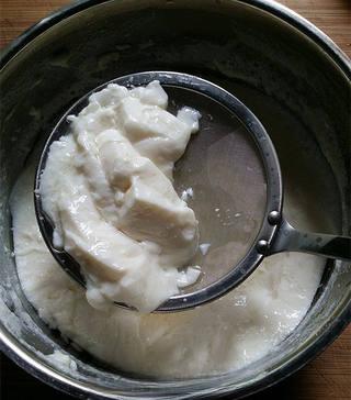 Savory Tofu Pudding step 12: Scoop the silky tofu pudding into serving bowls using a shallow spoon or straine
