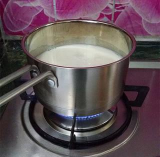 Savory Tofu Pudding step 6: Pour the strained soy milk into a saucepan and bring it to a gentle boil over lo