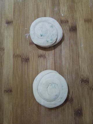 Whole Wheat Scallion Pancakes step 10: Gently stretch and coil each piece, then flatten slightly.