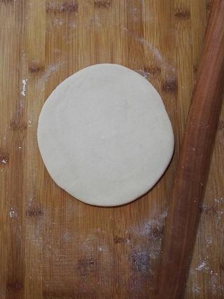 Whole Wheat Scallion Pancakes step 7: Roll one portion into a thin rectangular sheet.