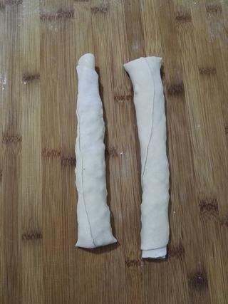 Whole Wheat Scallion Pancakes step 9: Roll the dough into a log from top to bottom, then cut the log into two equal pi