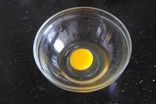Japanese Dorayaki Recipe step 2: Crack the egg into a mixing bowl.