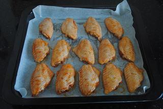 Orleans Chicken Wings Recipe step 5: Preheat the oven and line a baking tray with parchment paper. Arrange the marina