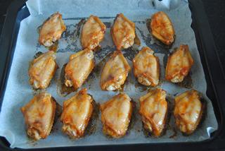 Orleans Chicken Wings Recipe step 7: Turn the wings over halfway through baking for even browning.