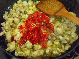 Chicken with Chopped Chili Peppers Recipe step 5: Add the chopped chili peppers, garlic, ginger, and scallions. Stir-fry over high