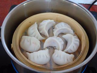 Crystal Shrimp Dumplings (Har Gow) step 10: Bring water to a boil in a steamer and place the basket inside. Cover tightly.