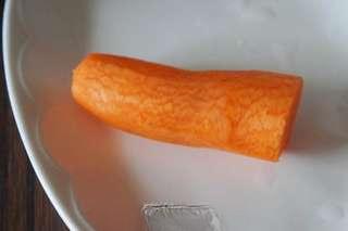 Soft Corn Pancakes step 2: Peel and wash the carrot, then shred it finely.