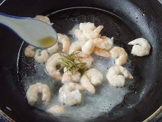 Shrimp with Dragon Well Tea Recipe step 7: Season with rice wine and salt, then stir-fry briefly until fragrant.