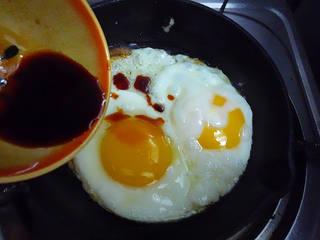 Aromatic Egg Pancake step 6: Cook until the underside is lightly golden. Pour in the seasoning sauce and simm