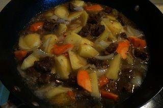 Braised Beef Curry Recipe step 9: Pour in enough hot water to cover the ingredients. Season with soy sauce and sal