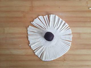 Red Bean Puff Pastry Recipe step 5: Place a ball of red bean paste in the center of each pastry sheet.
