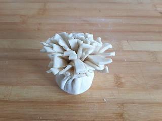 Red Bean Puff Pastry Recipe step 6: Wrap the pastry around the filling and pinch the edges to seal securely.