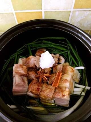 Clay Pot Braised Pork Belly Recipe step 8: Add the rock sugar, star anise, and cinnamon stick.