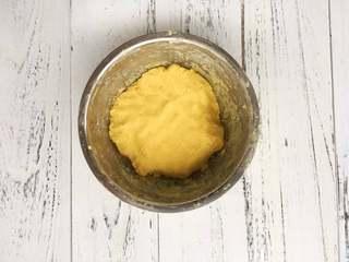 Cheese-Filled Sweet Potato Sesame Balls step 3: Allow the mixture to cool slightly. Add the tapioca starch and a small amount of