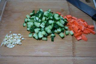 Peanut Cucumber Salad Recipe step 5: Dice the cucumber and carrot, slice the celery, and finely mince the garlic.