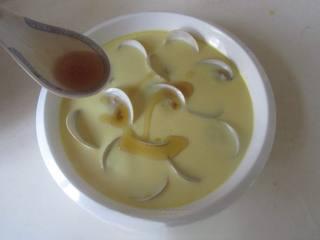 Steamed Egg Custard with Clams step 10: Remove from the steamer and drizzle with sesame oil. Garnish with finely chopped