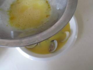 Steamed Egg Custard with Clams step 7: Arrange the cooked clams in a shallow heatproof dish. Strain the egg mixture thr