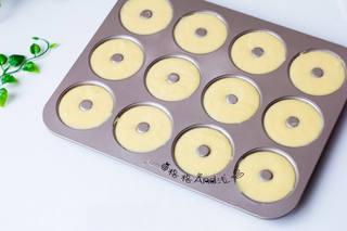 Almond Baked Donut Recipe step 6: Transfer the batter to a piping bag and pipe it evenly into greased donut molds.