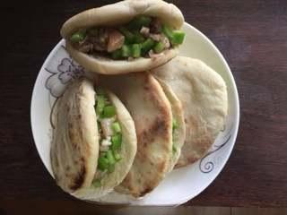 Pan-Fried Flatbread with Preserved Pork Recipe step 14: Fill with the chopped preserved pork and green pepper mixture. Add extra meat sa