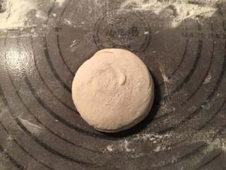 Pan-Fried Flatbread with Preserved Pork Recipe step 6: Stand the dough upright and gently press it flat.