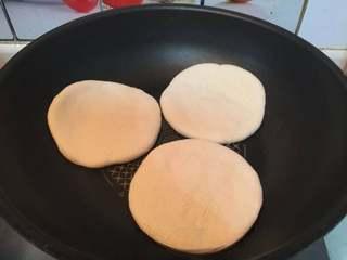 Pan-Fried Flatbread with Preserved Pork Recipe step 8: Place the flatbread in a dry skillet without oil.