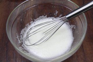Double-Skin Milk Pudding with Red Beans step 6: Add the sugar to the warm milk and stir until fully dissolved.