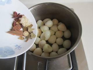 Beer-Braised Quail Eggs step 4: Return the peeled quail eggs to the pot. Add rock sugar, star anise, cinnamon st