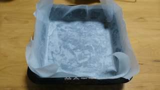 Black Forest Cake step 13: Line an 8-inch cake pan with parchment paper.