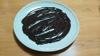 Black Forest Cake step 16: Spread the melted chocolate thinly on a tray and chill until firm.