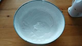 Black Forest Cake step 18: Whip the cream with sugar until stiff peaks form.