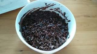 Black Forest Cake step 22: Scrape the chilled chocolate into curls or shavings.
